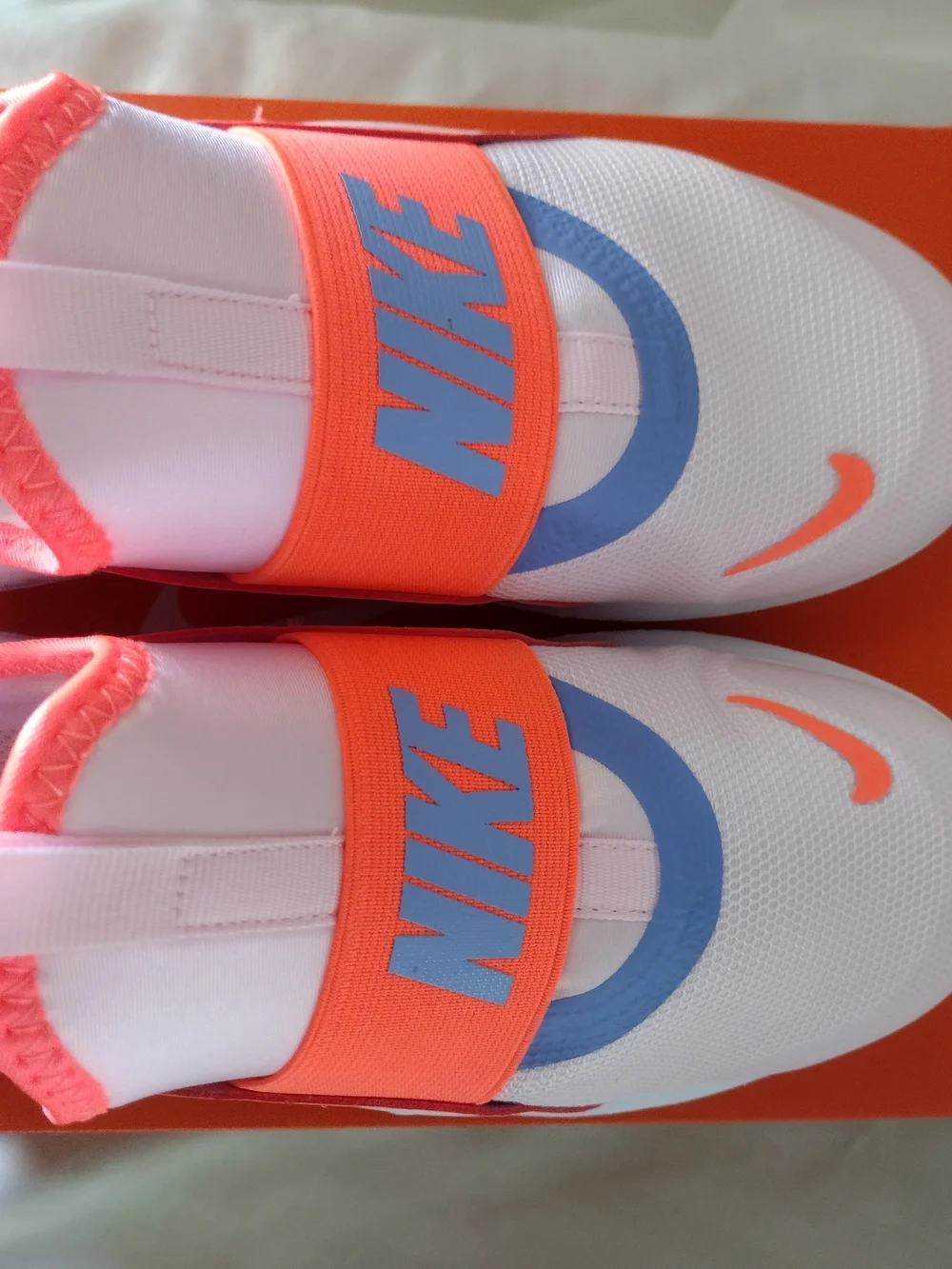 Nike Kids Slip-On Sneakers in White, Coral, Lavender